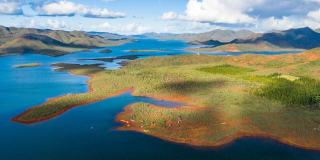 Aerial view of Rivière Bleue Provincial Park, Lac de Yaté and the red earth of New Caledonia's Grand Sud.