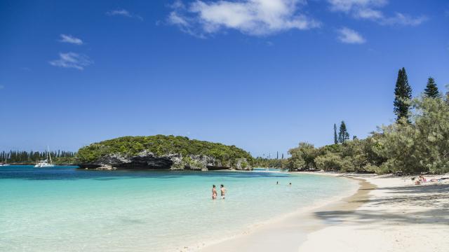 View of Kanumera Bay, its beach and rock on Île des Pins, New Caledonia.