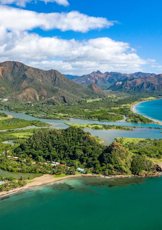 Aerial view of the commune of Thio, New Caledonia, overlooking the Bota Méré lookout, the village and the mountains.
