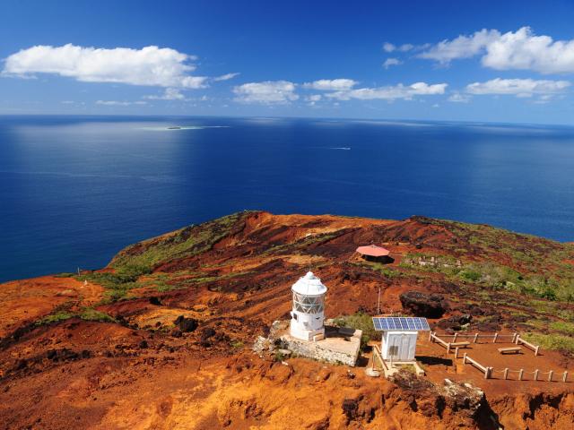View of Cap N'dua, a nature reserve in the Grand Sud of New Caledonia, surrounded by red earth and the lagoon. You can also see the humpback whale observatory.