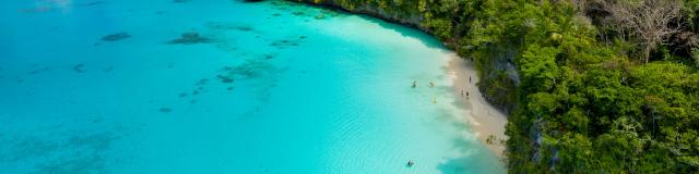 Aerial view of Kiki beach and the turquoise lagoon of Lifou, Loyalty Island, New Caledonia.