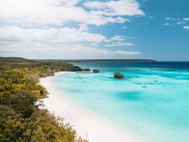 Aerial view of Luengoni beach and the lagoon at Mu, Lifou, Loyalty Islands, New Caledonia.