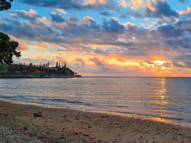 Sunset on the Baie des Citrons beach in Nouméa, New Caledonia.