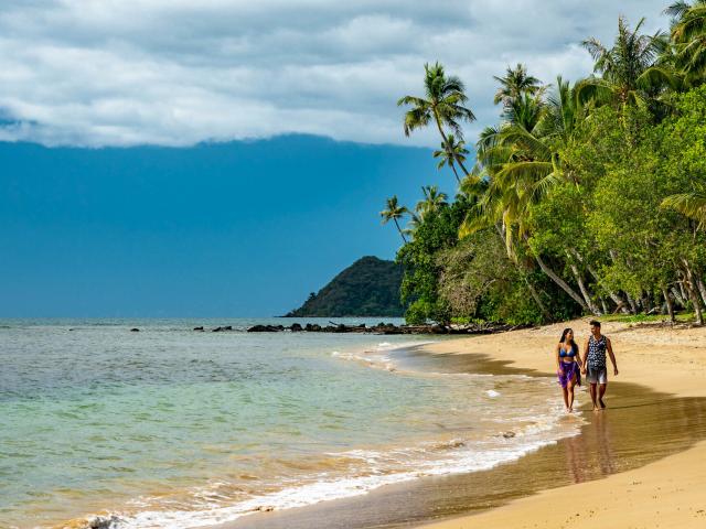 A couple's stroll on Moara beach in Thio, New Caledonia.