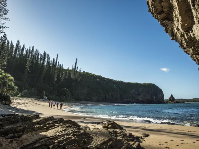 Relaxation on the beach of Baie des Tortues with a view of the Bonhomme de Bourail in New Caledonia.