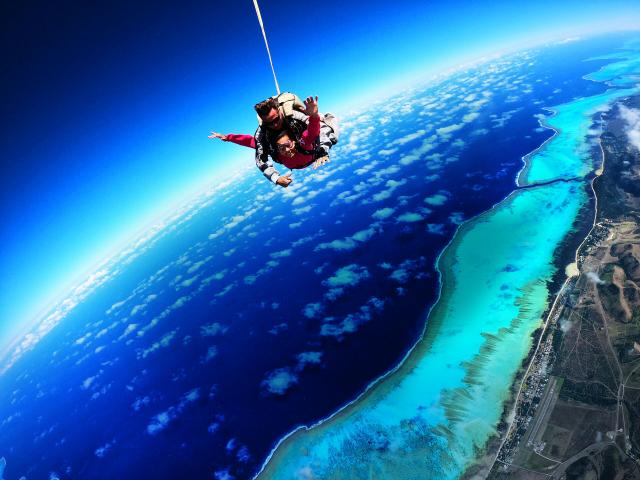 Skydiving over Poé lagoon in Bourail, New Caledonia.