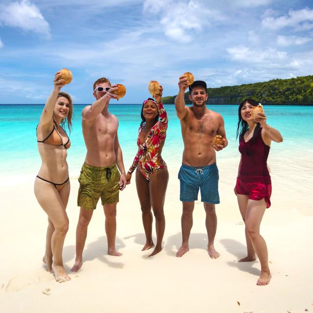 Enjoy a coconut on Kiki beach in Lifou