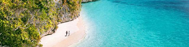 Aerial view of Kiki beach and the turquoise lagoon of Lifou, Loyalty Island, New Caledonia.