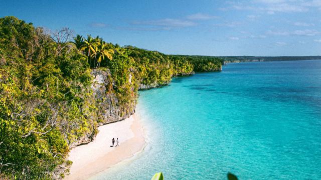 Aerial view of Kiki beach and the turquoise lagoon of Lifou, Loyalty Island, New Caledonia.