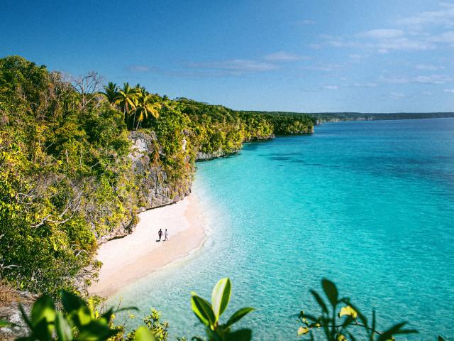 Aerial view of Kiki beach and the turquoise lagoon of Lifou, Loyalty Island, New Caledonia.