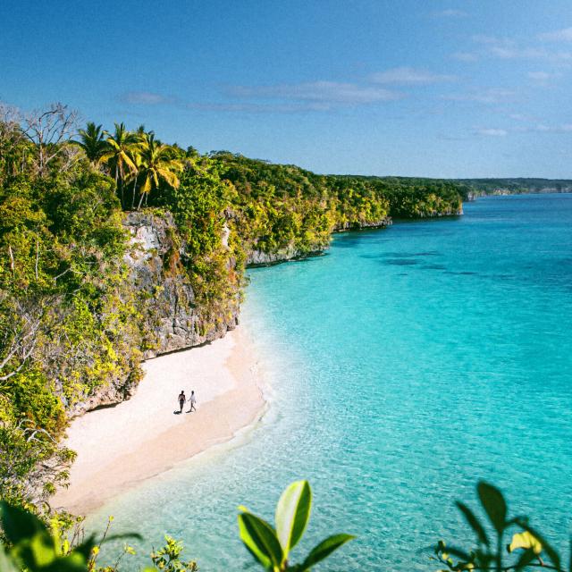 Aerial view of Kiki beach and the turquoise lagoon of Lifou, Loyalty Island, New Caledonia.