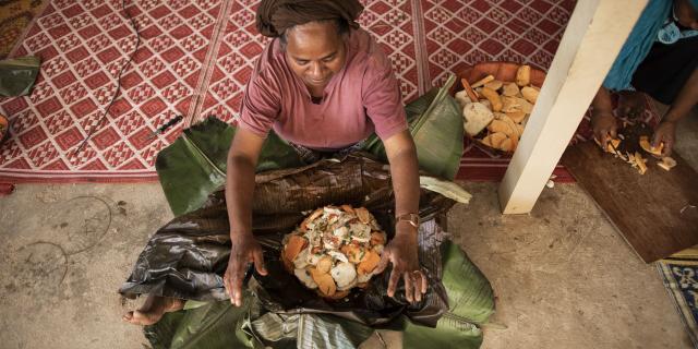 Preparing bougna, a traditional Kanak dish, in Lifou.