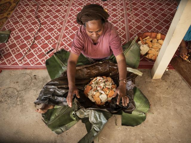 Preparing bougna, a traditional Kanak dish, in Lifou.