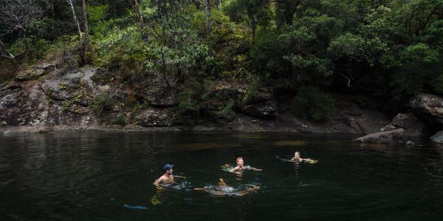 Bathing at the waterholes of the Tao waterfall