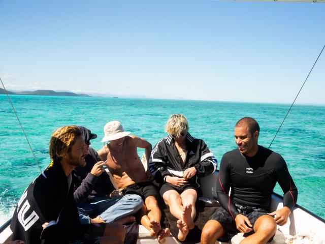 Surfing with friends in Bourail lagoon