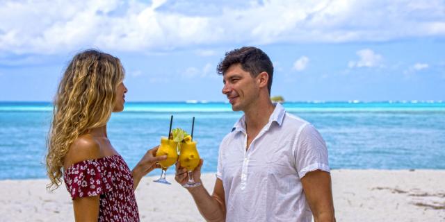 Cocktail couple on the beach in the islands of New Caledonia