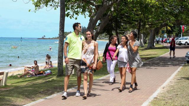 A family stroll along Anse Vata bay